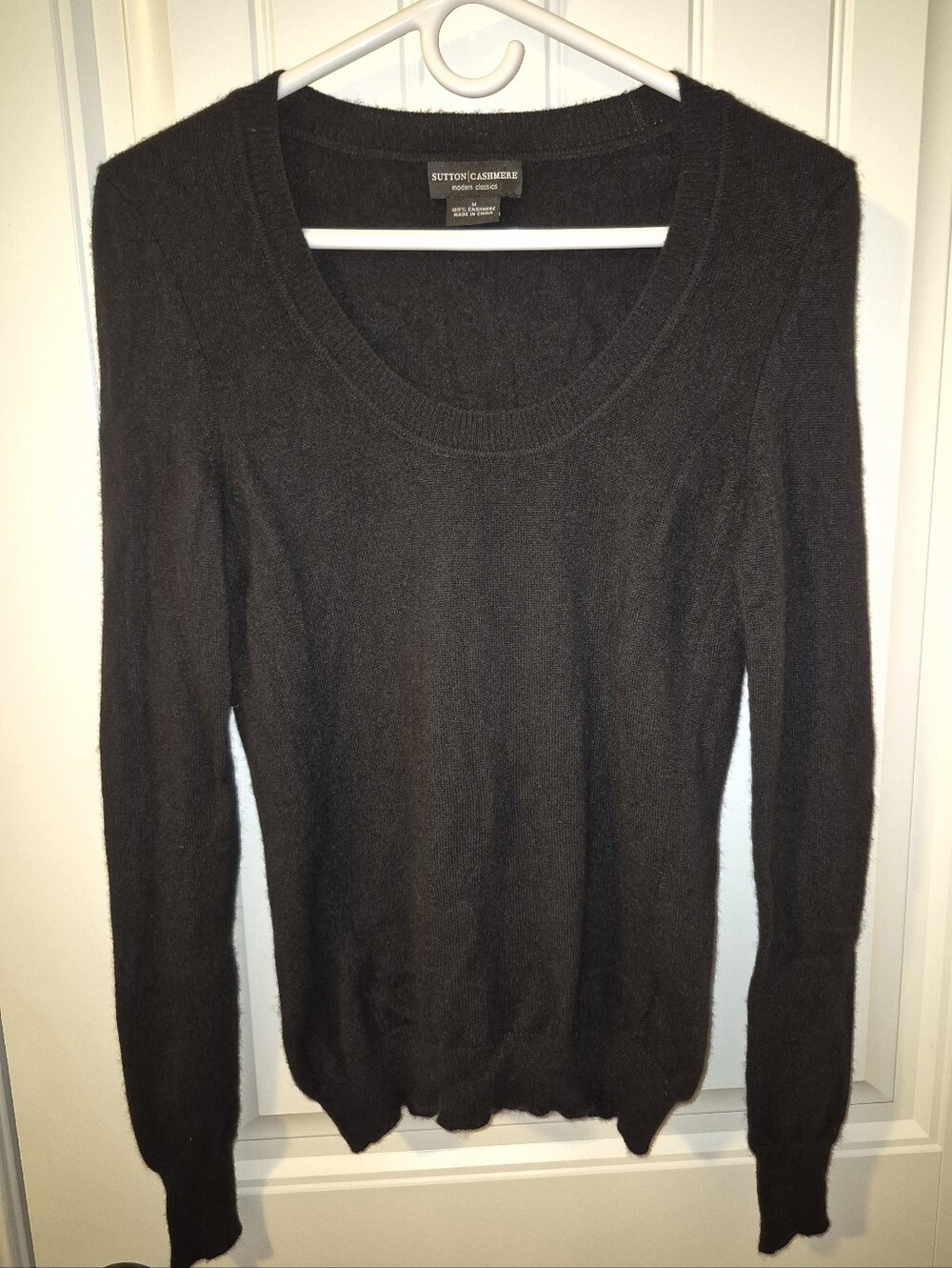 Black Sutton Cashmere long-sleeve scoop neck sweater.